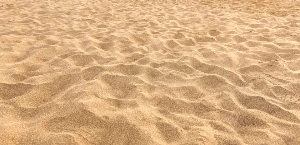Sand on the beach as background Stock Photos