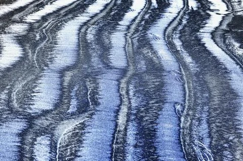 Sand on the beach creates an amazing pattern for the background Stock Photos