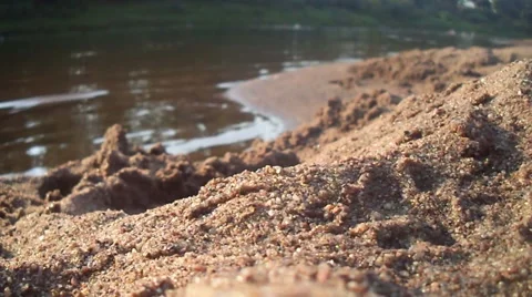 The sand on the beach near the river Stock Footage 56311522