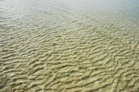Sand of a beach Stock Photos