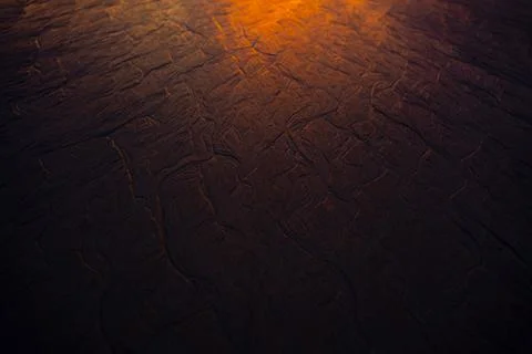 The sand beach at sunset background. Stock Photos