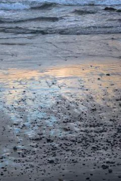 Sand on the beach sunset Stock Photos