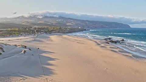 Sand beach surrounded by cliffs, Aerial Paradisiac beach holidays concept Vídeo Stock 220039897