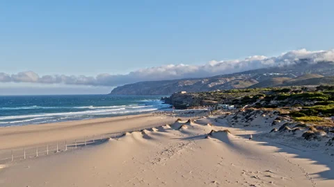 Sand beach surrounded by cliffs, Aerial Paradisiac beach holidays concept Vídeo Stock 220040579
