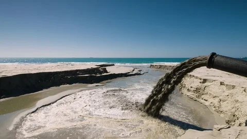 Sand being pumped onto beach to restore lost sand. Stock Footage 92330064