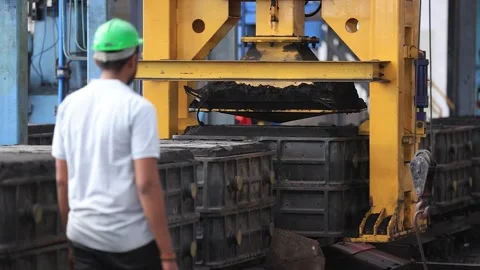 Sand is being separated from the finished casting part. Stock Footage 252569613