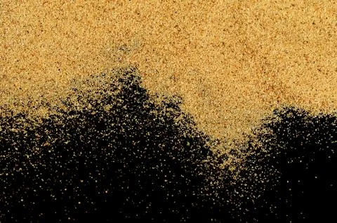 The sand on the black background Stock Photos