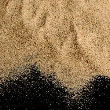 The sand on the black background Stock Photos