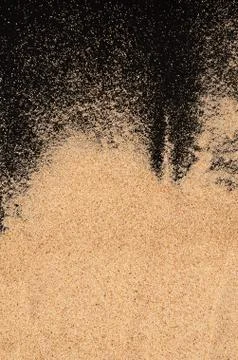 The sand on the black background Stock Photos