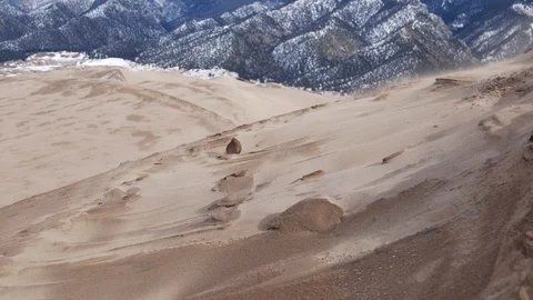 Sand blowing across the dunes in Great Sand Dunes National Park Stock Footage 125544246