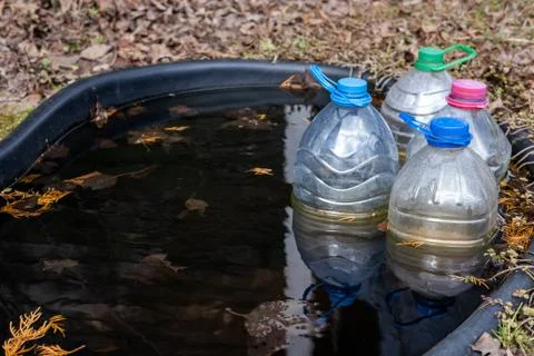 Sand bottles in the pond. Stock Photos