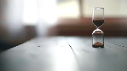 Sand capsule timer on table, video Video stock 71655900
