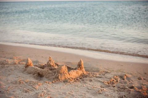Sand castle on the beach Stock Photos