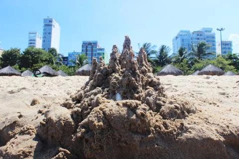 Sand castle on beachfront Stock Photos
