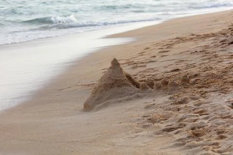 A sand castle is built on the beach Stock Photos