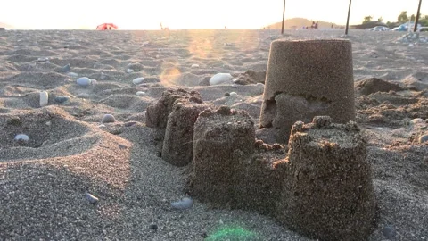 Sand castle on the nearly empty beach | Stock Video | Pond5