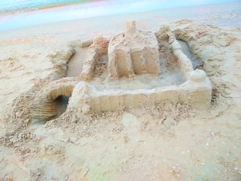 .Sand castle on the shore of the sea of rectangular shape. Stock Photos