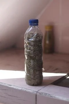 Sand in a clear bottle Stock Photos