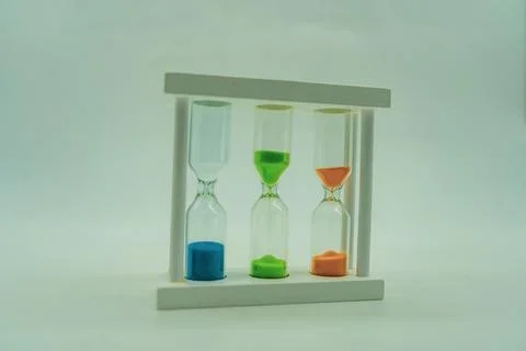 Sand clock with a different kind of colored sand Stockfoto's