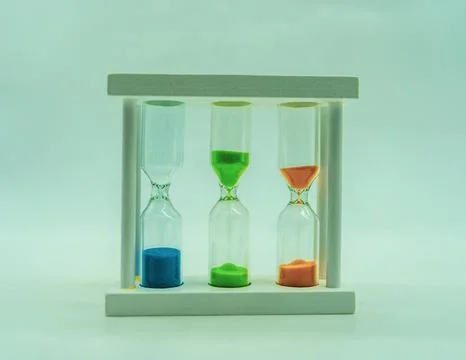 Sand clock with a different kind of colored sand Stock Photos