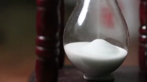 Sand clock Hourglass running close-up Stock Footage 18188507
