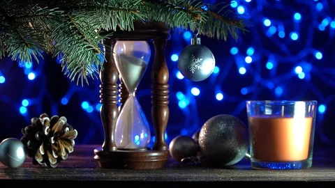 Sand clock that indicates the time remaining until Xmas, toys of winter holidays Stock Footage 99122224