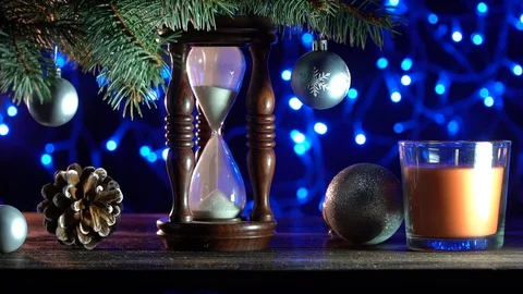 Sand clock that indicates the time remaining until Xmas, toys of winter holidays Stock Footage 99122489