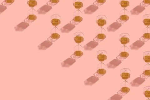 Sand clock pattern on pink background Stock Photos