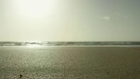 Sand close-up at the beach and ocean in early morning Stock Footage 78760905