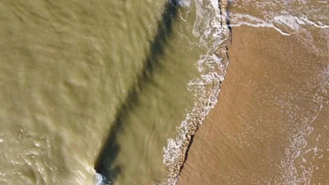 Sand-colored waves with foam from North Sea water on the beach Stock-Footage 164202970