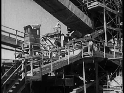 Sand is combined in a uniform mixture to create the concrete for theƒ Stock Footage 75273627