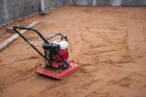 Sand compactor at a construction site. Tool at a construction site. Stock Photos