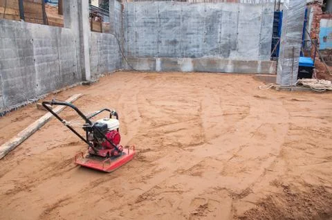 Sand compactor at a construction site. Tool at a construction site. Stock Photos