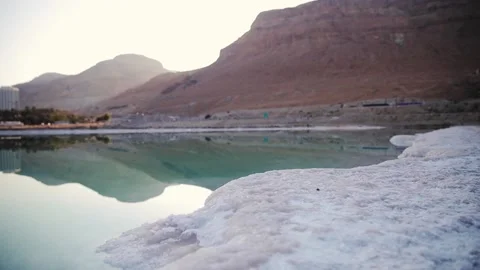 Sand completely covered with crystalline salt looks like ice or snow on shore of Stock Footage 181647662