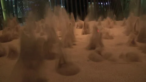 Sand compressed air motion eruption experiment science museum Stock Footage 327207126