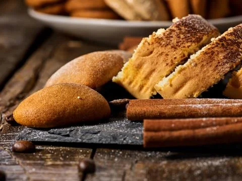 Sand cookies heart shape, rolled cake with cherry and cinnamon Stock-Fotos