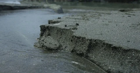 Sand Crumbling Into Stream Of Water Video stock 70845684