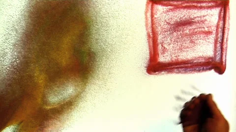 Sand drawing for titles uses Stock Footage 32965493