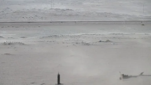Sand drift because of strong wind storm in Namib desert fringe near Kolmanskop L Stock Footage 102740671