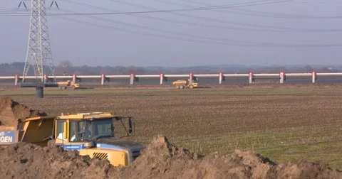 Sand dumpers on track in room for the river landscape Stock Footage 73347246