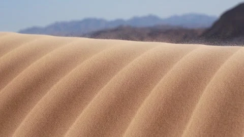 Sand Dune Ridge Close-up on the Background of Mountains Stock Footage 243940833