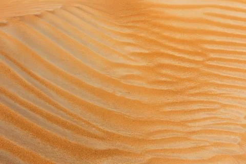 Sand dune texture close-up view, with wave pattern formed by the wind, Dubai Fotos de archivo