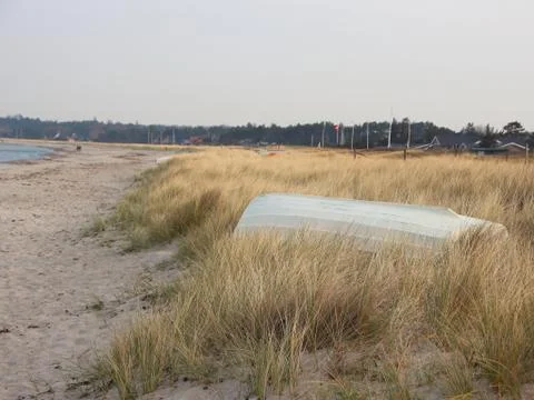 Sand Dune with Upside Down Rowing Boat Stock Photos