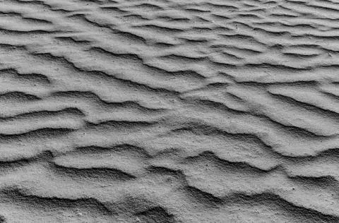Sand dune wave pattern background texture, gray styled Stock Photos