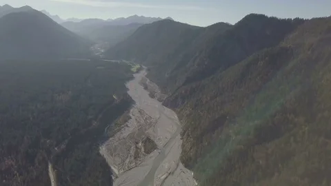Sand dunes between in the mountains territory of Sylvensteinsee Aerial Stock Footage 83825519