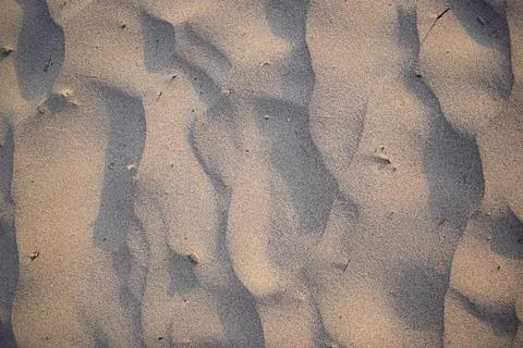 Sand dunes created by the wind. Lay flat Stock Photos