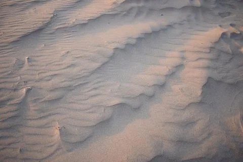 Sand dunes created by the wind. Lay flat Stock Photos