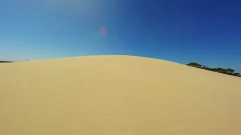 Sand dunes in the desert during the day, drone video Stock Footage 245416092
