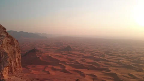 Sand dunes in the desert as the sun rises aerial Stock Footage 254948248