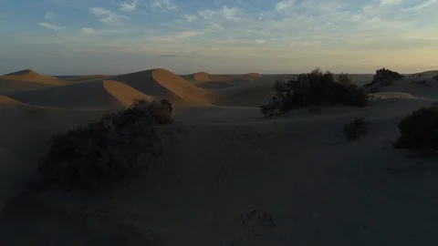Sand Dunes - Desert Sunset Flying Low Along Dunes From Darker to Lighter Stock Footage 100708562